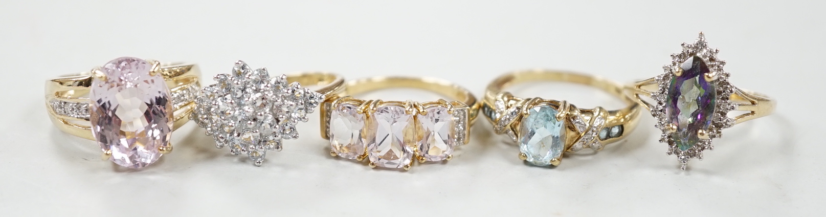 Five assorted modern 9ct gold and gen set rings, including kunzite and diamond, size N, gross 17.5 grams.